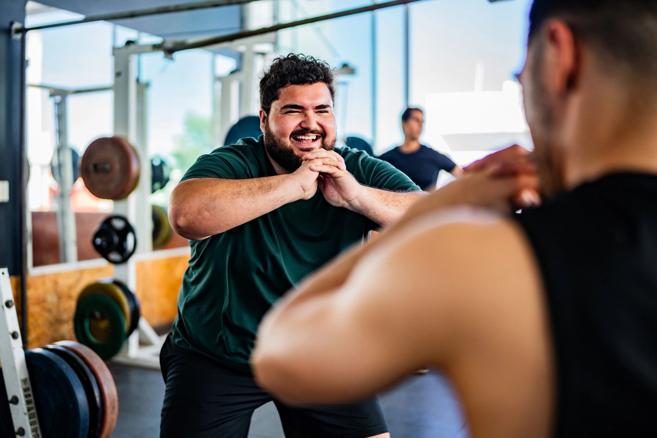 Coach leading a men's group fitness class at Mindset Fitness